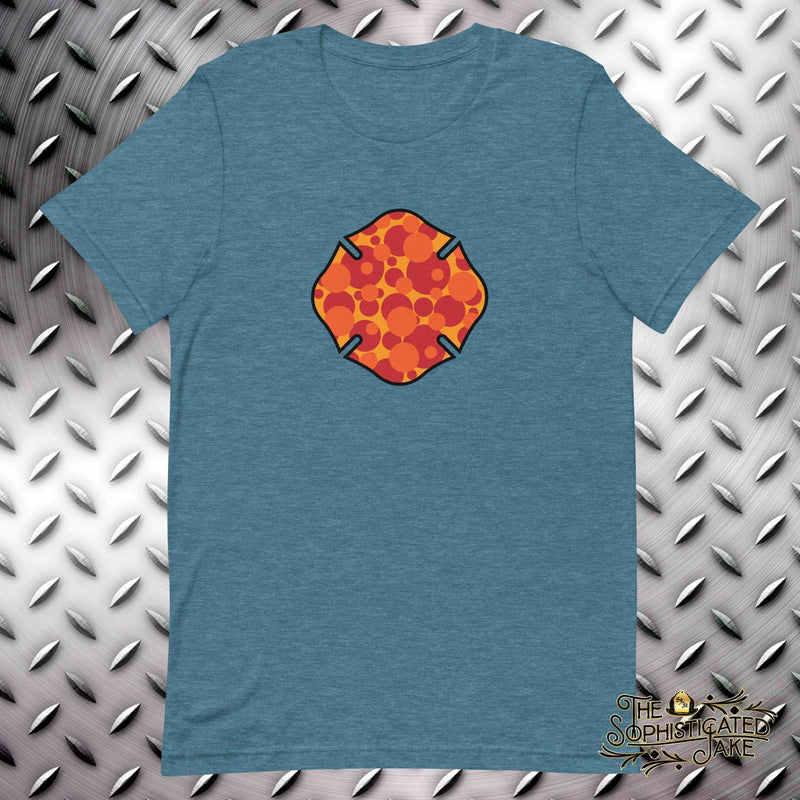 Teal t-shirt with a maltese cross on the front, filled with different sized orange, yellow, and red circles.