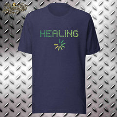 Navy t-shirt with design in the center of the chest.  In green and yellow there is the pixelated text "Healing" with a circular progress wheel below it.